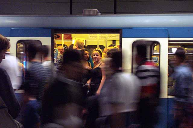 The crowds on the subway are headed to a soccer game at the Olympic stadium.