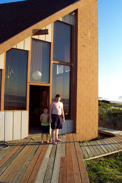 Andrew and Brigham in front of beach house