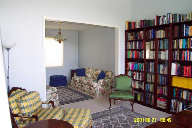 Dining room as TV room, with TV around the corner in an armoire